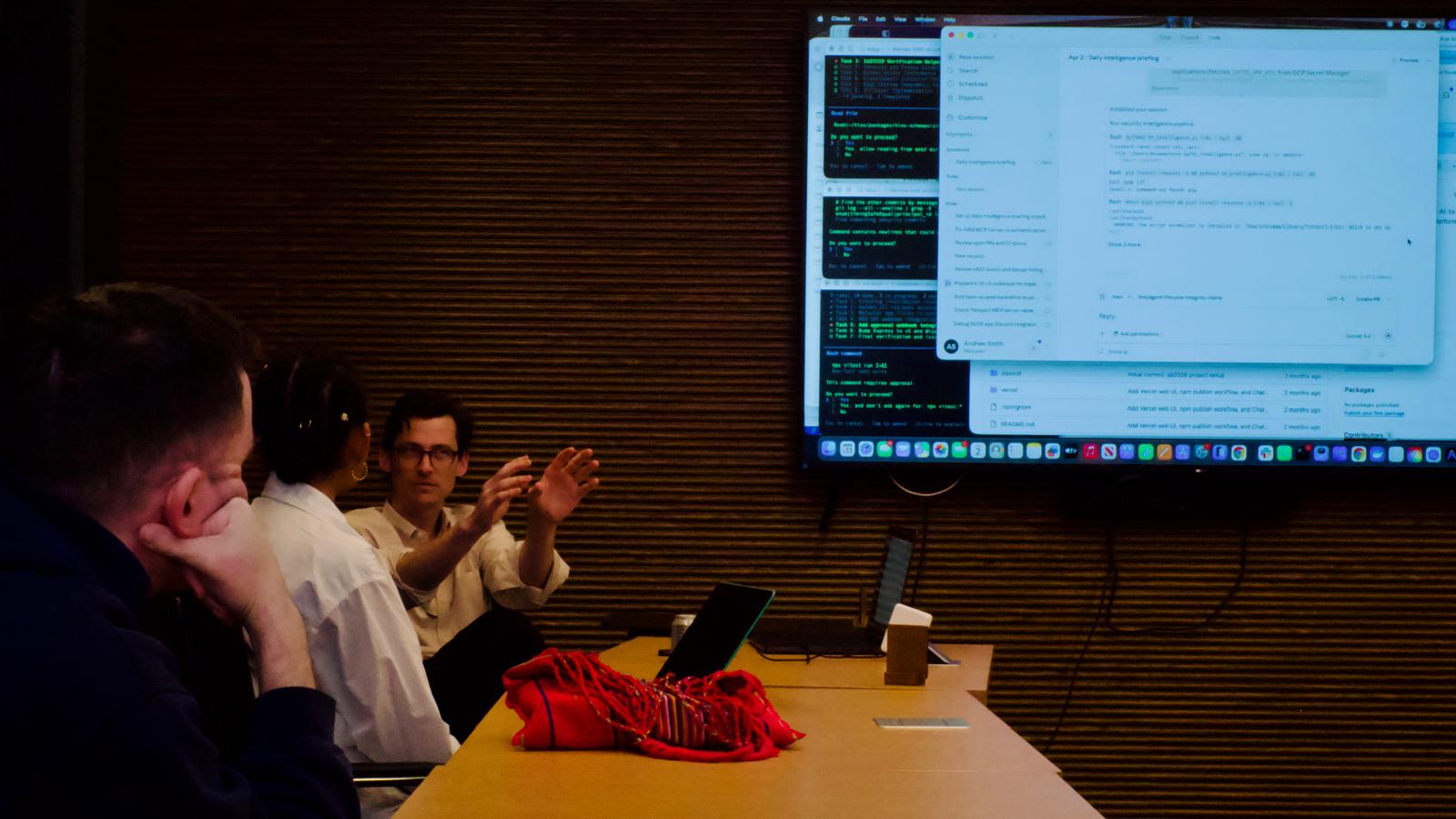 Team discussion with Claude Code on screen